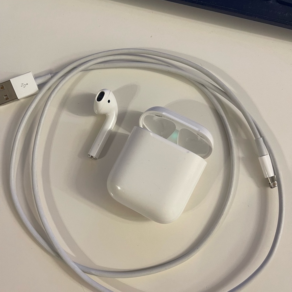 Left AirPod with case and charger